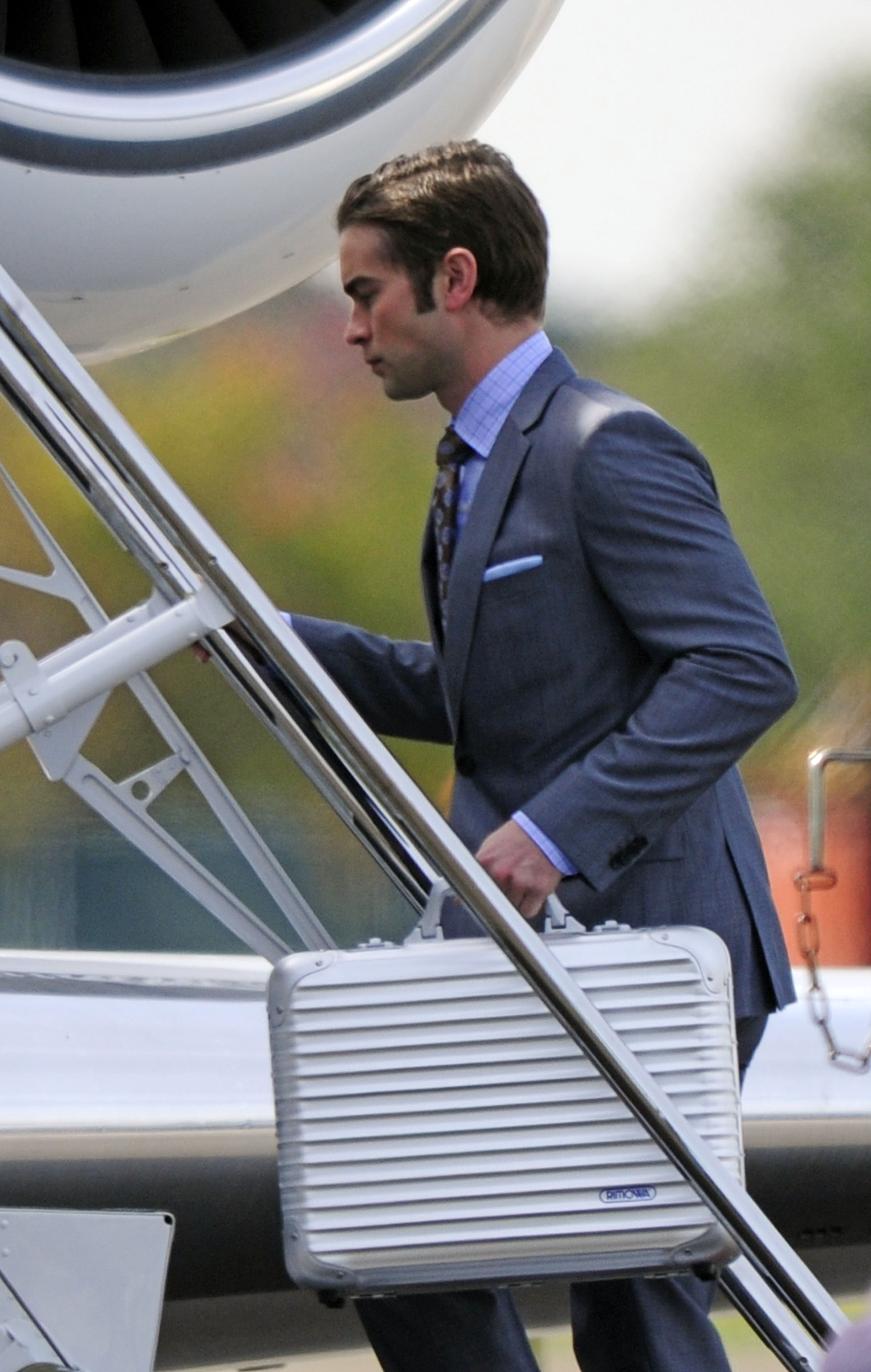 EXCLUSIVE: Chace Crawford climbs aboard a jumbo jet in Long Island, New York